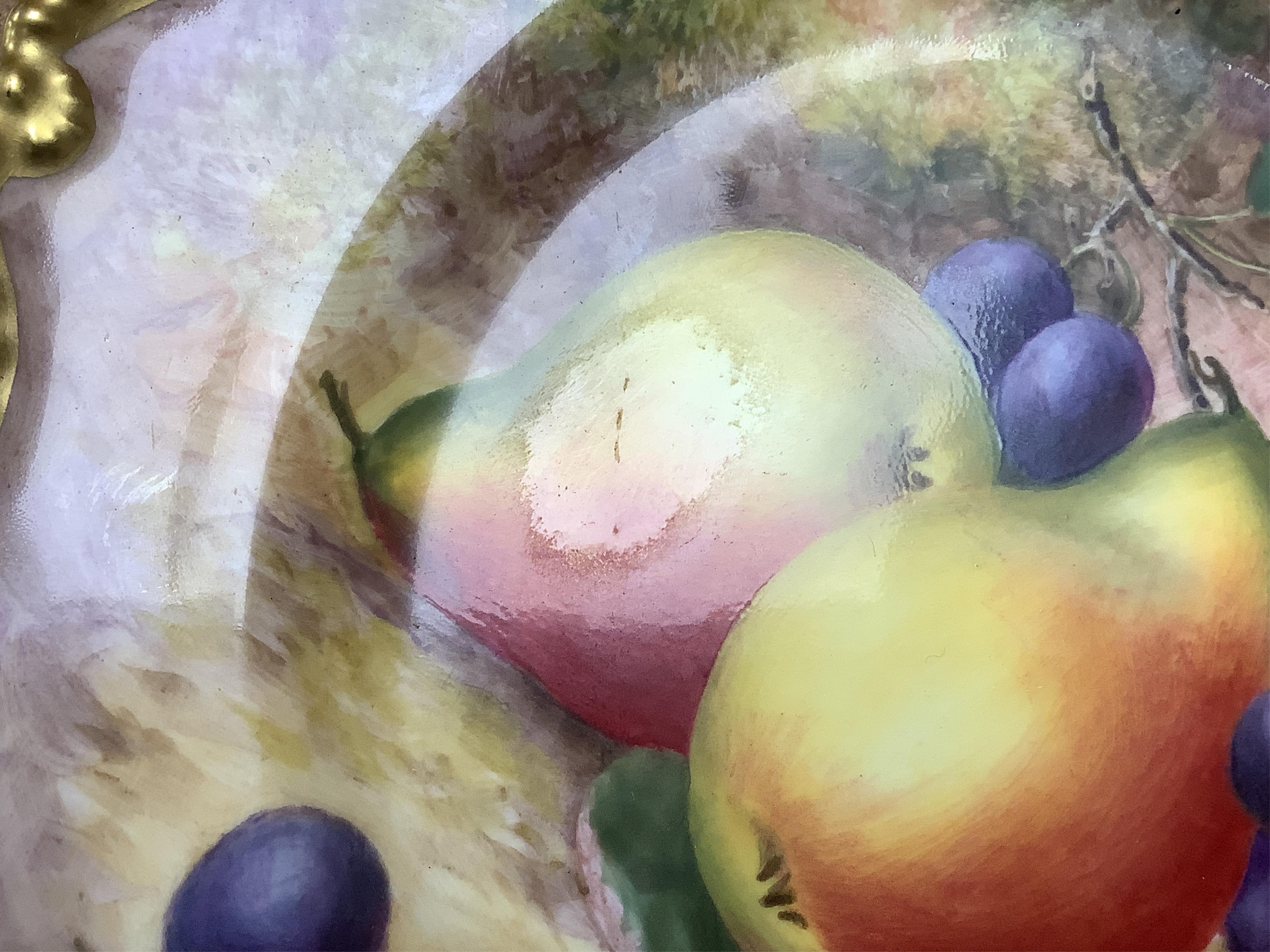 A Royal Worcester cabinet plate, painted with fruit by Harry Ayrton, signed, 22cm diameter.